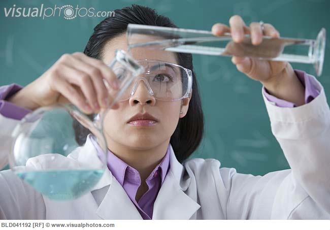 I know this woman is doing science because she's holding a beaker.