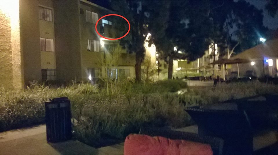 A cellphone image with the balcony of Cardinal Gardens, Rm F552 circled in red. (Photo Credit: Ivan Tsang / Facebook).