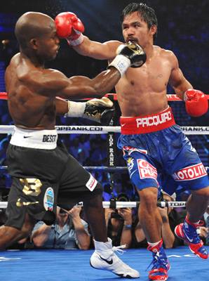 Pacquiao delivering a counter-punch to Bradley. This pretty much sums up the entire fight in a single image.