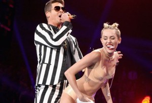 Miley Cyrus twerking on Robin Thicke.