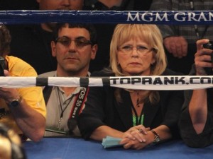 CJ Ross, sitting ring-side at a fight, as a judge.
