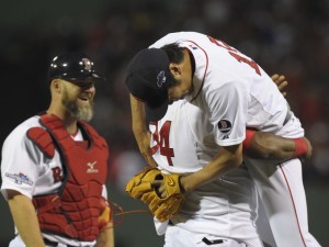 David Ortiz lifts up relief pitcher Koji Uehara after the Red Sox's Game 2 victory over Tampa.