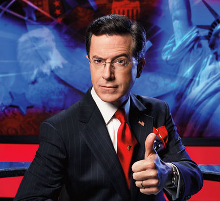 Stephen Colbert has carefully orchestrated a persona, and uses many forms of physical and verbal comedy to reinforce the exaggerated nature of his character. This suit, the eyebrow, the thumbs-up sign: they are careful exaggerations designed to both invoke and parody a very specific Fox News-esque persona.