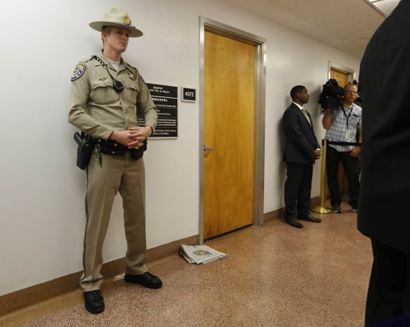State troopers stand guard in front of Senator Yee's office at the State Capitol. (Photo credit: AP/Rich Pedroncelli)