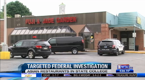Authorities raid Fuji & Jade Garden in State College, PA yesterday as part of a 9-restaurant raid of Asian businesses. (Screen capture: WTAJ)