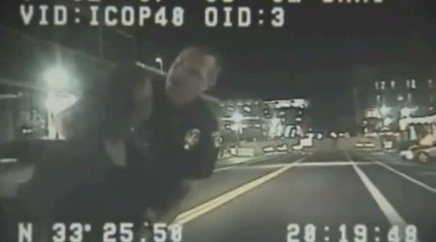 Screen-capture of dashcam video showing Officer Stewart Ferrin screaming at ASU professor Ersula Ore moments before he throws her to the ground.