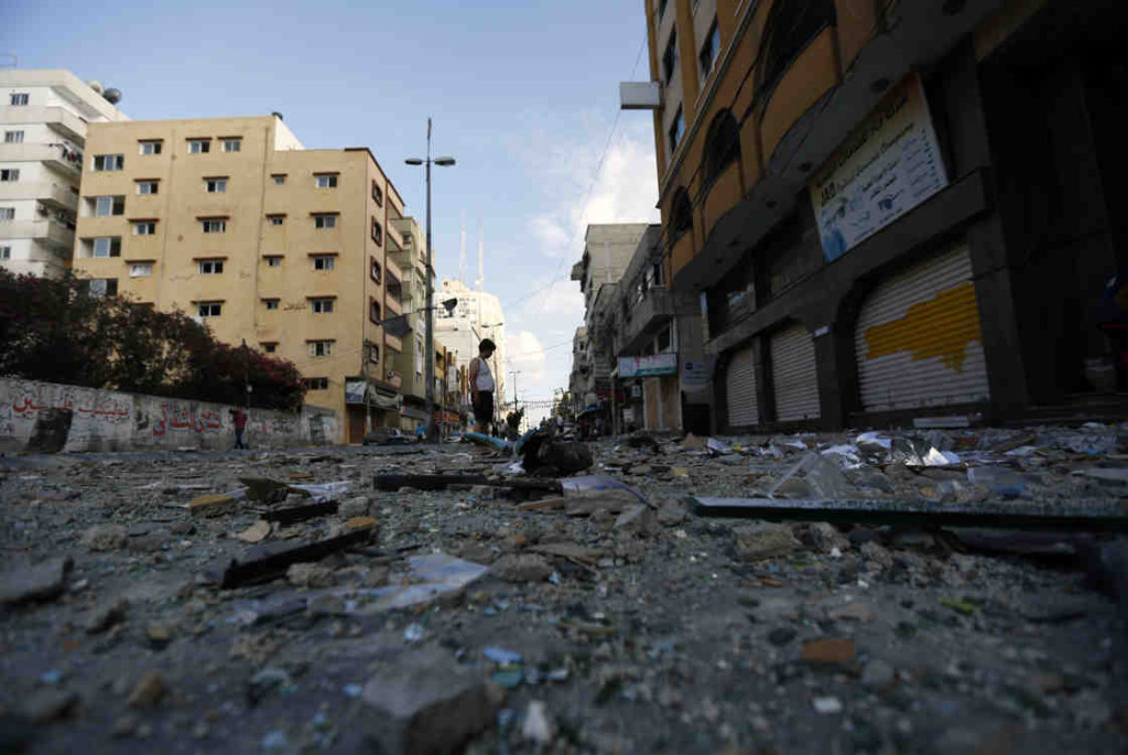In Gaza City, a Palestinian man stands amid debris after an Israeli airstrike. (Photo: Mohammed Abed/AFP/Getty Images)