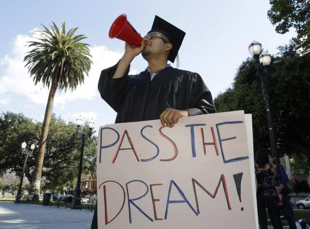 Demonstrator Ruben Bernal, who recently graduated from San Jose State University, rallies for the Dream Act in downtown San Jose, Calif., Wednesday, June 29, 2011. The Dream Act legislation would provide a path to legalization for certain young people brought to the U.S. illegally by their parents. The bill has been introduced several times in Congress without success. A Senate subcommittee held a hearing on the legislation on Tuesday. (AP Photo/Paul Sakuma)
