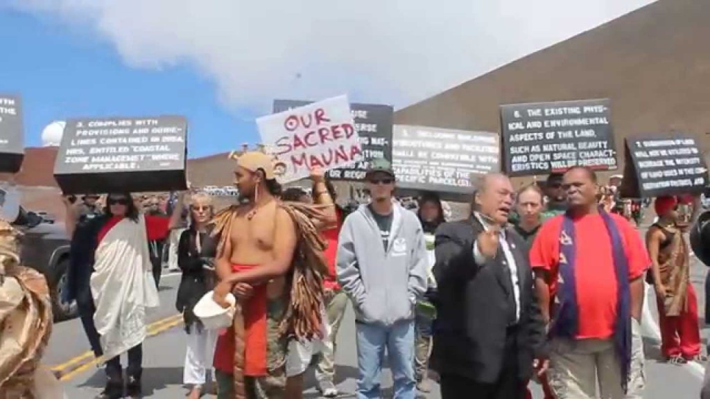 Protesters march to protect the summit of Mauna Kea from a construction project they say will desecrate it.