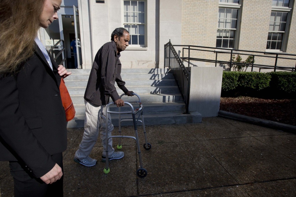 Sureshbhai Patel enters the courthouse in the trial against his assailant, Alabama police officer Eric Parker, who paralyzed Patel following a routine pedestrian stop. (Photo credit: AP/Brynn Anderson)