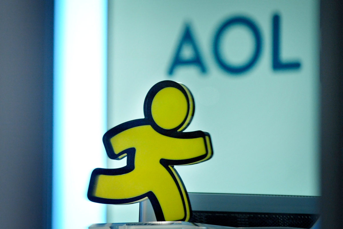 A logo and an AOL-messenger-figure is pictured at the entrance of the AOL office in Hamburg on January 12, 2010. US Internet company AOL announced on January 12 that it intends to close its French and German offices as part of a worldwide round of job cuts. In Germany, AOL will close its offices in Hamburg, Duesseldorf, Frankfurt and Munich, cutting 140 jobs, a spokesman said. AFP PHOTO DDP / PHILIPP GUELLAND GERMANY OUT (Photo credit should read PHILIPP GUELLAND/AFP/Getty Images)